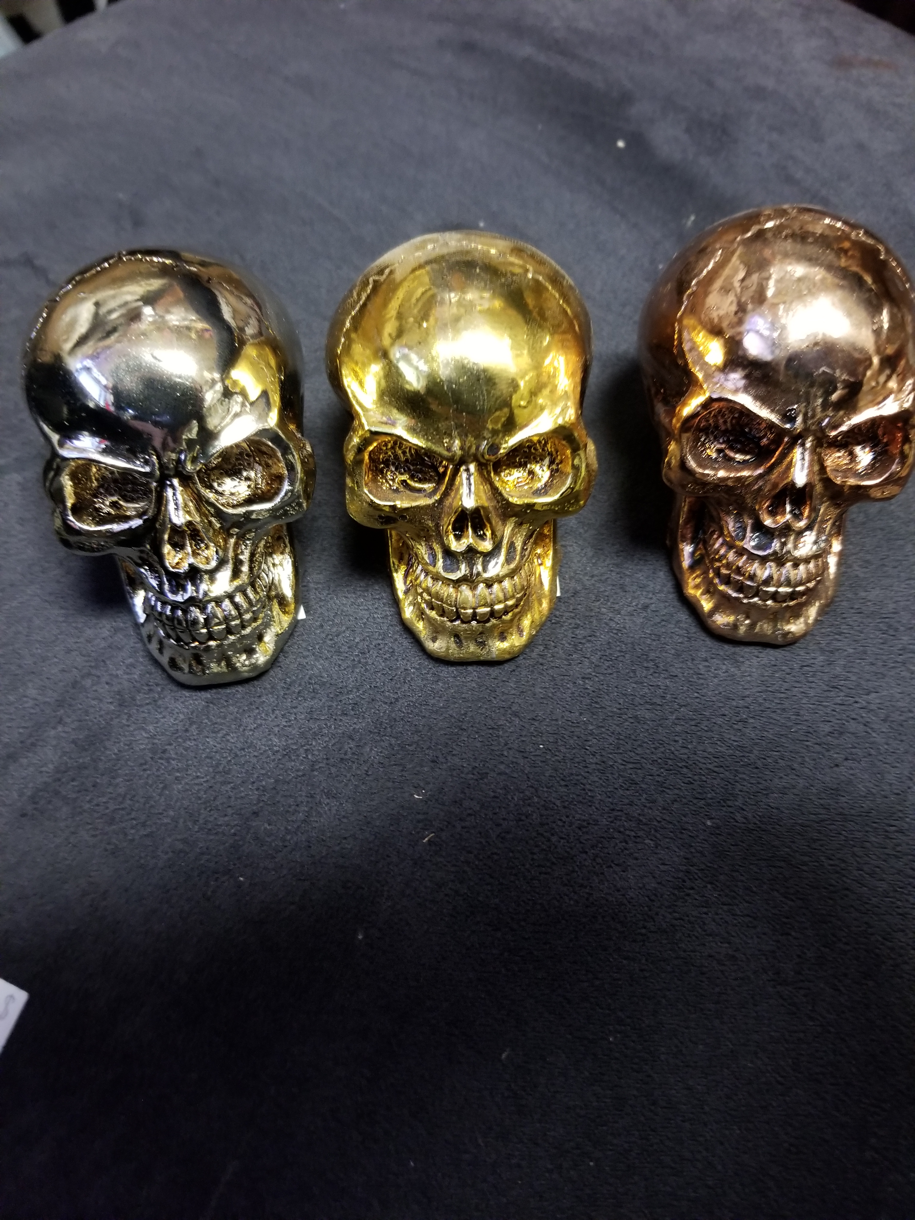 Small metallic colored skulls